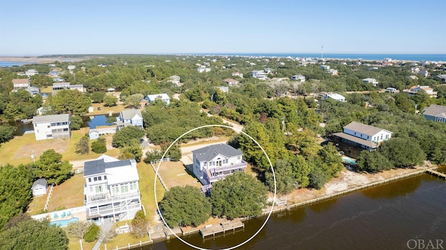 birds eye view of property featuring a water view and a residential view