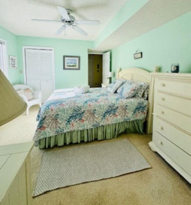 290 Hillcrest Dr Lot 22, Southern Shores, NC 27949 - bedroom featuring a textured ceiling, a ceiling fan, and carpet floors