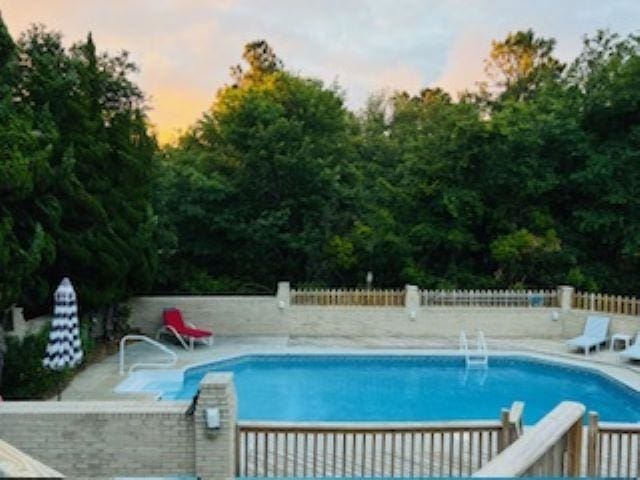 290 Hillcrest Dr Lot 22, Southern Shores, NC 27949 - view of swimming pool featuring a diving board, a patio, a fenced in pool, and fence