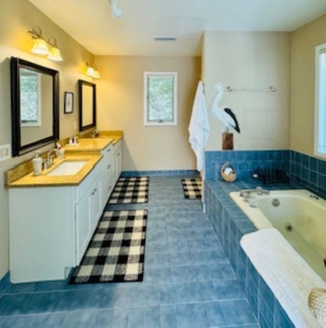 290 Hillcrest Dr Lot 22, Southern Shores, NC 27949 - bathroom with a bath, visible vents, a sink, tile patterned floors, and double vanity