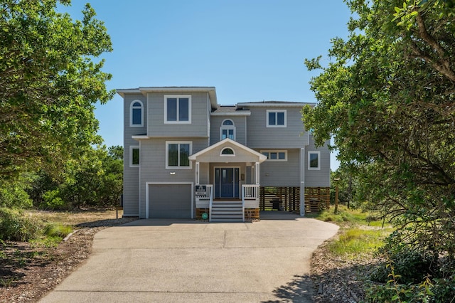 view of front of house featuring driveway and a garage