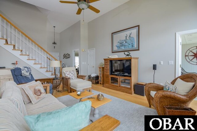 4025 Ivy Ln Lot 11, Kitty Hawk, NC 27949 - living area with stairway, ceiling fan, wood finished floors, and high vaulted ceiling