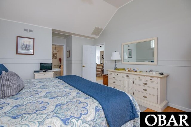 4025 Ivy Ln Lot 11, Kitty Hawk, NC 27949 - bedroom with visible vents, light wood-style flooring, and vaulted ceiling