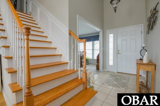 4025 Ivy Ln Lot 11, Kitty Hawk, NC 27949 - foyer featuring a towering ceiling, light tile patterned floors, and stairway