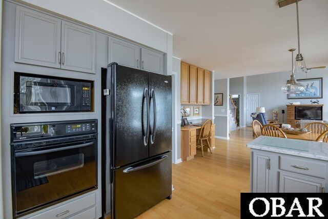 4025 Ivy Ln Lot 11, Kitty Hawk, NC 27949 - kitchen featuring light wood-style flooring, decorative light fixtures, black appliances, and gray cabinetry