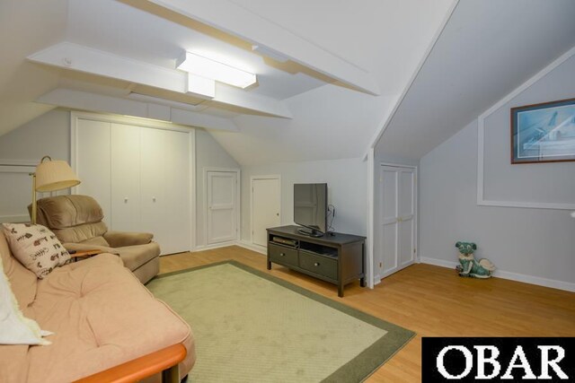 4025 Ivy Ln Lot 11, Kitty Hawk, NC 27949 - living room featuring baseboards, vaulted ceiling, and wood finished floors