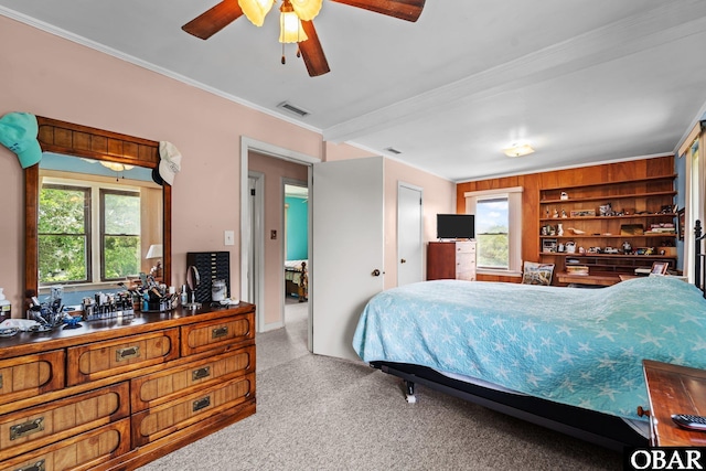 57194 M V Australia Ln, Hatteras, NC 27943 - bedroom with ornamental molding, carpet, multiple windows, and ceiling fan