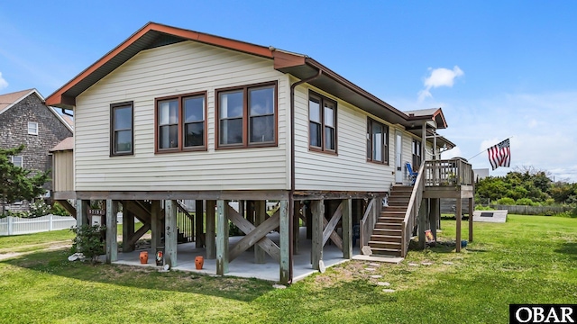 57194 M V Australia Ln, Hatteras, NC 27943 - view of home's exterior with stairway, a patio area, and a wooden deck