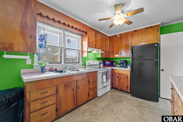 57194 M V Australia Ln, Hatteras, NC 27943 - kitchen with freestanding refrigerator, electric stove, under cabinet range hood, a sink, and light countertops