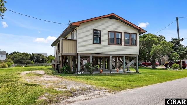 57194 M V Australia Ln, Hatteras, NC 27943 - view of front of house featuring a front lawn and stairway