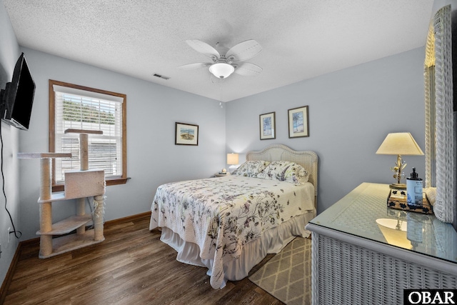 305 W Fourth St Lot 7, Kill Devil Hills, NC 27948 - bedroom with wood finished floors, ceiling fan, and a textured ceiling