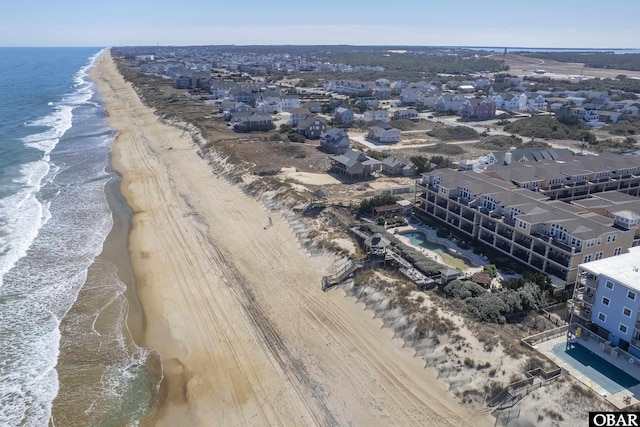 aerial view featuring a water view and a view of the beach