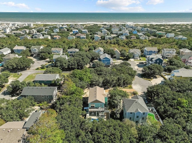 drone / aerial view featuring a residential view and a water view