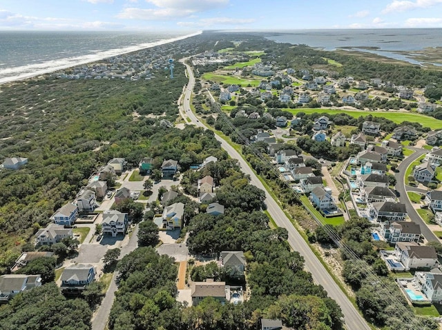 bird's eye view featuring a water view and a residential view