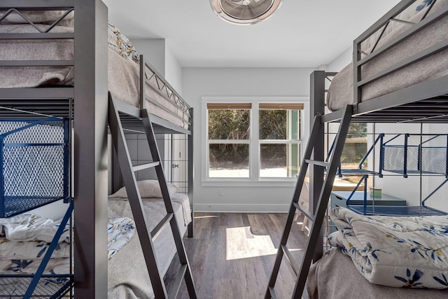 bedroom with wood finished floors and baseboards