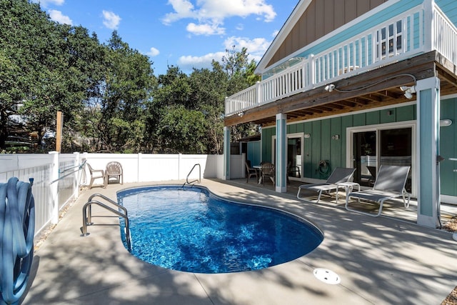 view of swimming pool with a fenced backyard, a deck, a fenced in pool, and a patio