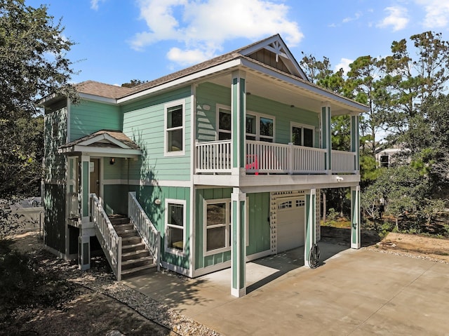 view of front of home with driveway, an attached garage, and board and batten siding