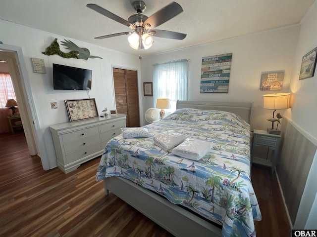 3737 Hallett St Lot # 100, Kitty Hawk, NC 27949 - bedroom with dark wood-style flooring, a closet, ornamental molding, and ceiling fan