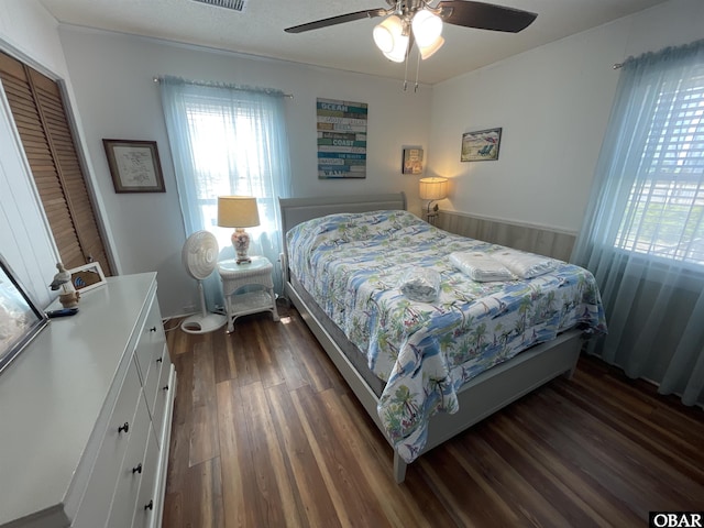 3737 Hallett St Lot # 100, Kitty Hawk, NC 27949 - bedroom with dark wood-style floors and ceiling fan