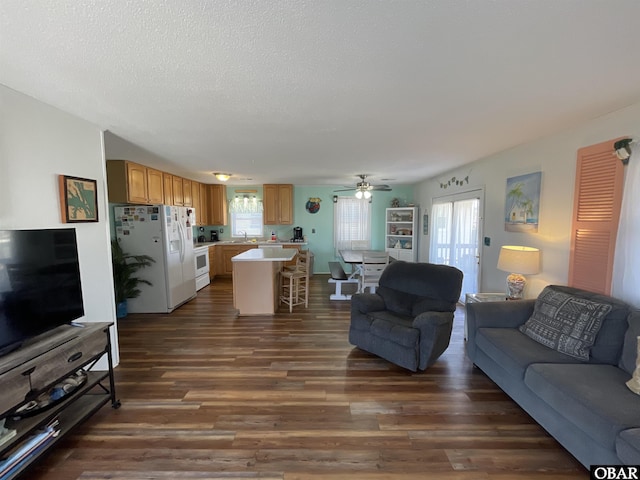 3737 Hallett St Lot # 100, Kitty Hawk, NC 27949 - living room featuring dark wood-type flooring, ceiling fan, and a textured ceiling