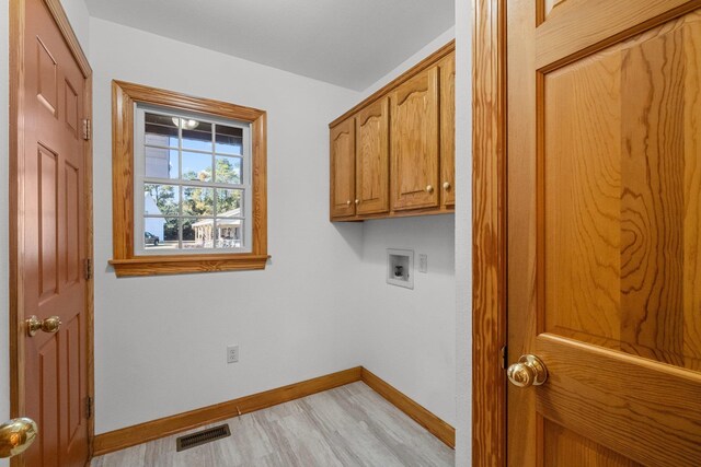136 Daphne Ln Lot 15, Manteo, NC 27954 - washroom featuring cabinet space, washer hookup, baseboards, and light wood-style floors