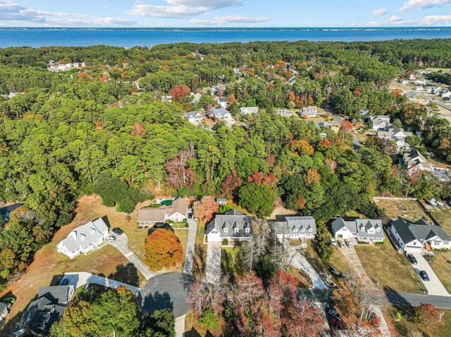 136 Daphne Ln Lot 15, Manteo, NC 27954 - aerial overview of property's location featuring a heavily wooded area, nearby suburban area, and a large body of water