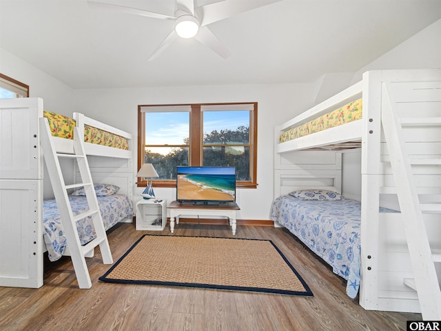 bedroom with ceiling fan and dark wood-type flooring