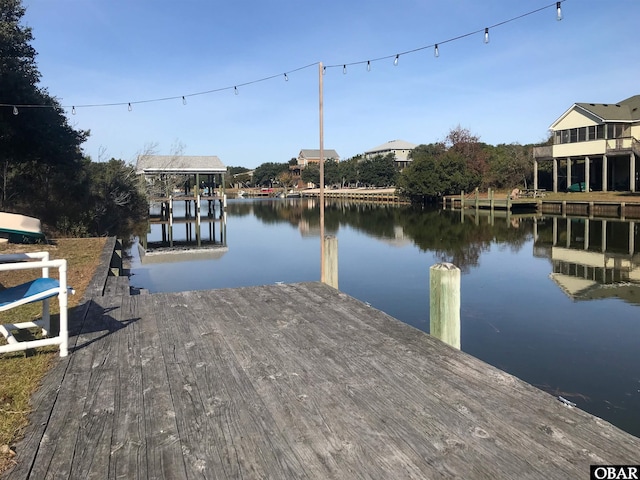 dock area with a water view