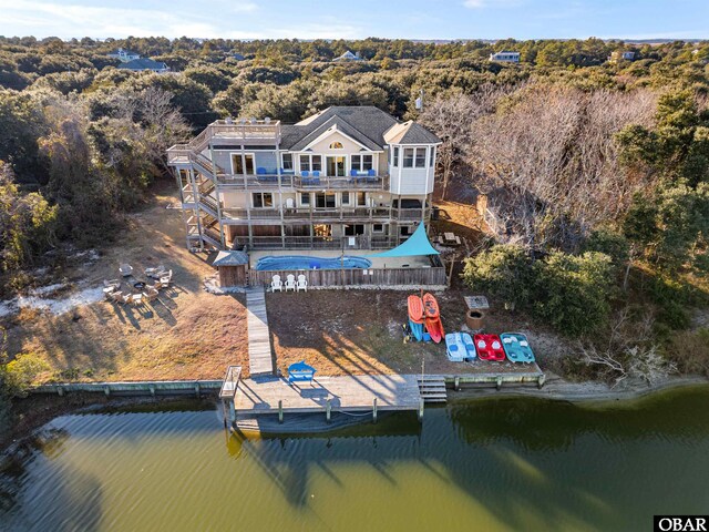 2203 Pike Rd Lot 37, Corolla, NC 27927 - dock with a deck with water view, stairway, a wooded view, and a balcony