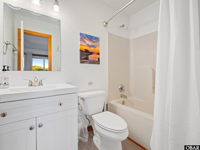 full bathroom featuring a textured wall, tile patterned flooring, toilet, vanity, and shower / bath combination with curtain