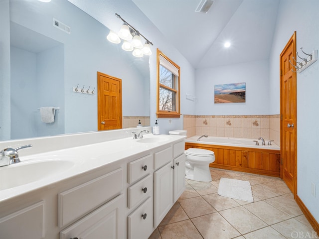 full bath featuring lofted ceiling, a sink, visible vents, and tile patterned floors