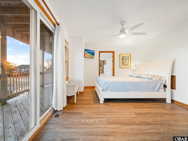 bedroom featuring access to outside, visible vents, ceiling fan, light wood-type flooring, and baseboards