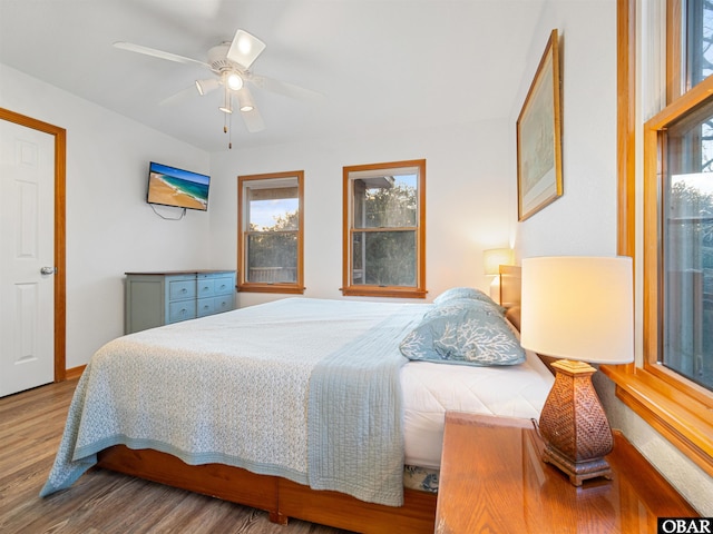 bedroom featuring ceiling fan and wood finished floors