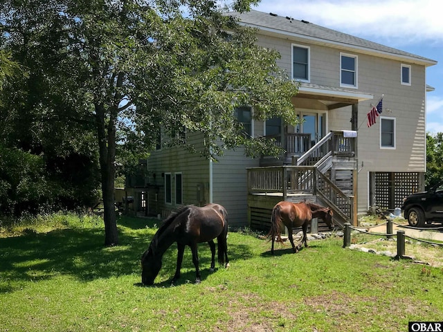 exterior space featuring a porch and a yard