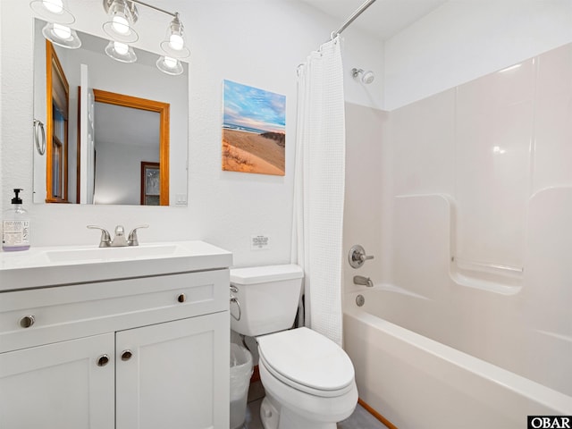 full bath featuring toilet, shower / bath combo with shower curtain, and vanity