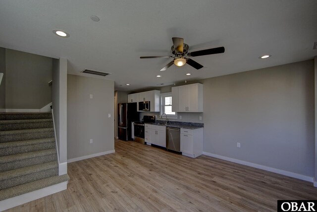 27250 Sand St Lot # 7, Salvo, NC 27972 - unfurnished living room with a sink, a ceiling fan, stairs, recessed lighting, and light wood-style flooring