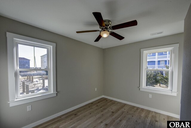 27250 Sand St Lot # 7, Salvo, NC 27972 - hall with lofted ceiling, healthy amount of natural light, wood finished floors, an upstairs landing, and baseboards
