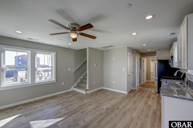 27250 Sand St Lot # 7, Salvo, NC 27972 - kitchen with appliances with stainless steel finishes, a sink, light wood-style floors, white cabinets, and recessed lighting