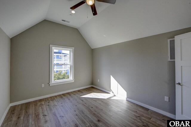 27250 Sand St Lot # 7, Salvo, NC 27972 - unfurnished bedroom featuring lofted ceiling, light wood-type flooring, baseboards, and ceiling fan