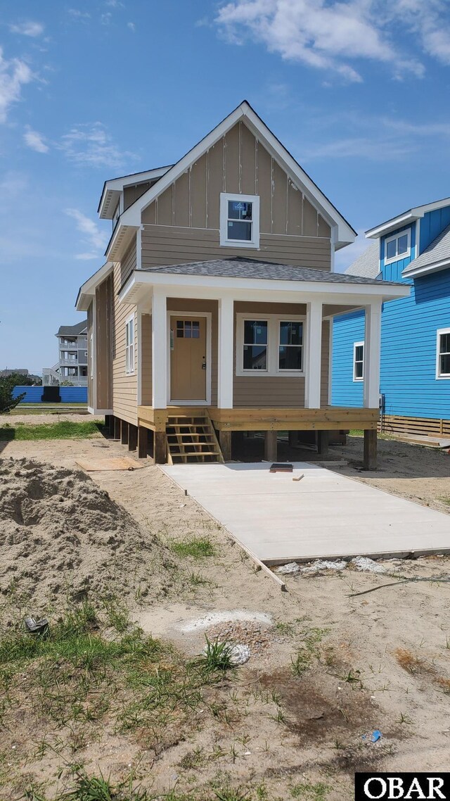 27250 Sand St Lot # 7, Salvo, NC 27972 - view of front of property with board and batten siding and covered porch