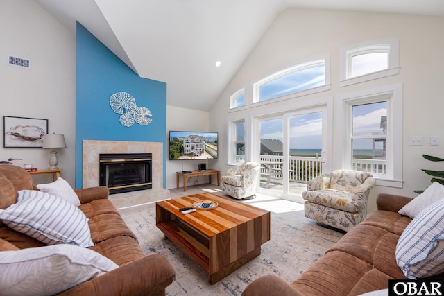 25245 Island Pines Dr Lot 6, Waves, NC 27982 - living area with visible vents, a fireplace, and high vaulted ceiling