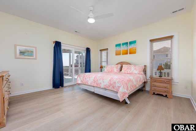 25245 Island Pines Dr Lot 6, Waves, NC 27982 - bedroom featuring multiple windows, visible vents, light wood-type flooring, and access to exterior