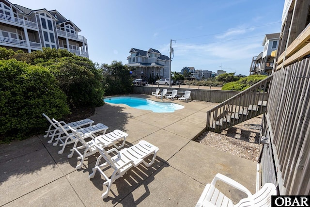 25245 Island Pines Dr Lot 6, Waves, NC 27982 - pool featuring fence, stairs, and a patio area