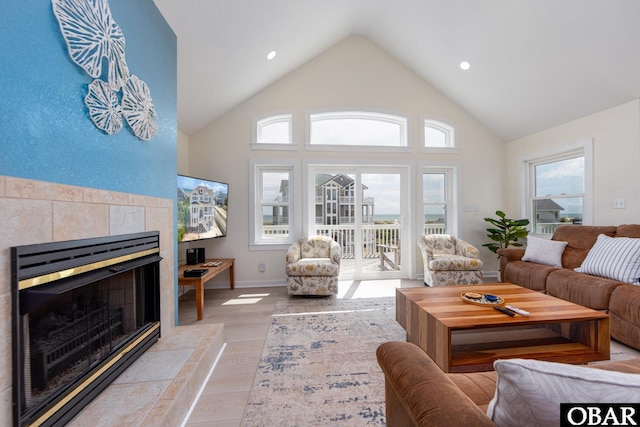 25245 Island Pines Dr Lot 6, Waves, NC 27982 - living room with light wood-style flooring, recessed lighting, baseboards, high vaulted ceiling, and a fireplace