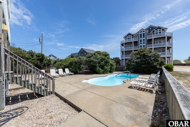 25245 Island Pines Dr Lot 6, Waves, NC 27982 - community pool with a patio area and stairs