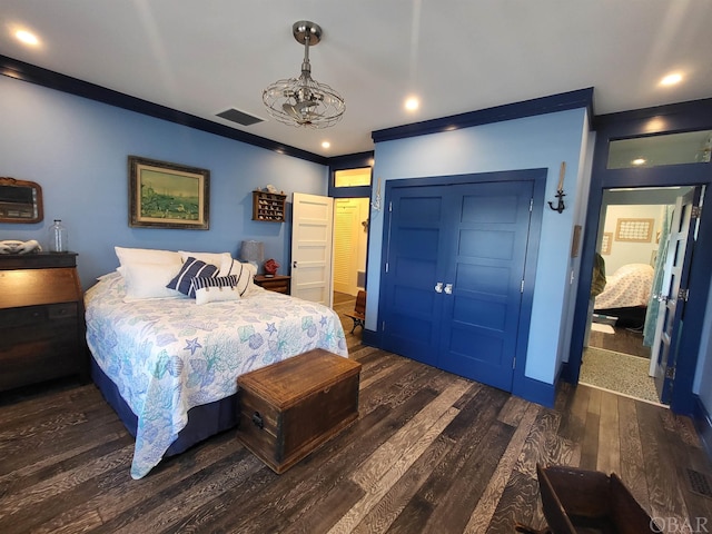 bedroom featuring dark wood finished floors, crown molding, recessed lighting, a closet, and visible vents