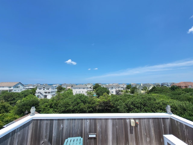 wooden deck featuring a residential view