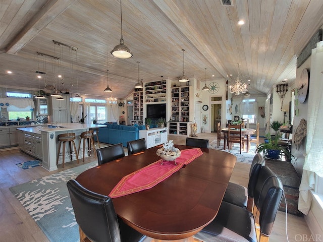 dining space with wood ceiling, a notable chandelier, vaulted ceiling, and light wood finished floors