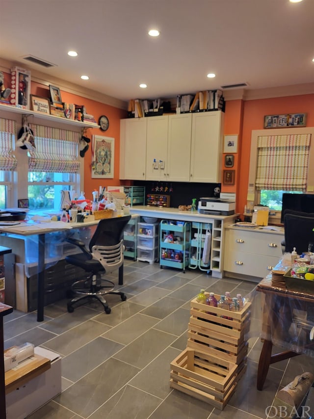 kitchen with dark tile patterned floors, visible vents, white cabinets, and recessed lighting