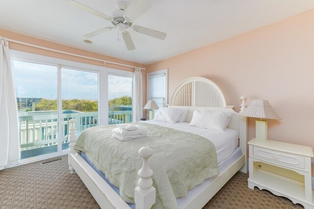 carpeted bedroom with access to exterior, ceiling fan, and visible vents